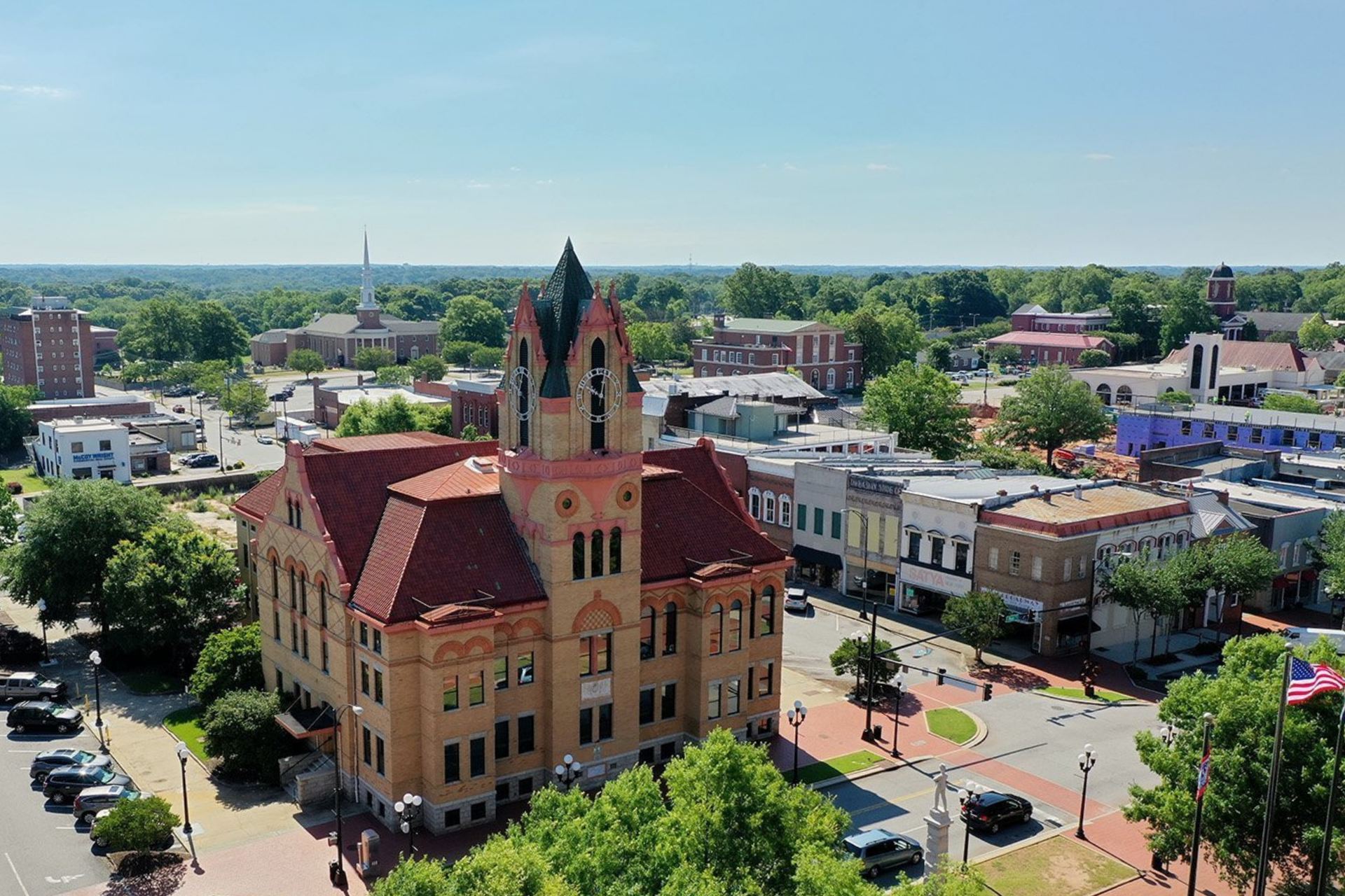 Aerial view of downtown Anderson, South Carolina, featuring the historic courthouse and surrounding city streets.