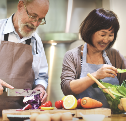 Senior couple cooking together Senior couple cooking together